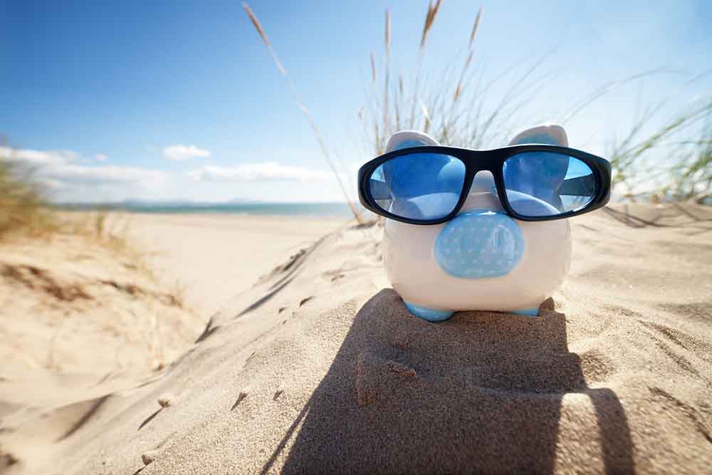 piggy-bank-wearing-sunglasses-on-beach 