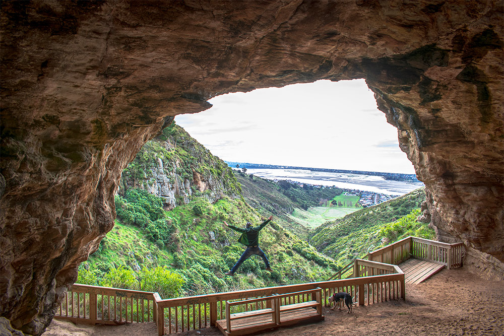 man-jumping-in-cave-in-new-zealand 